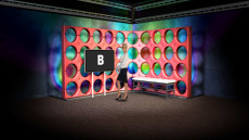 Virtual Set Studio 129 for 4K is a trendy interview set with a red wall and monitor.