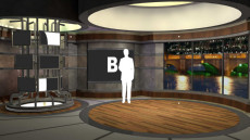 Virtual Set Studio 134 for 4K is a stage with a circular tower of screens and a view of a city at night.